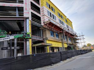 construction site with scaffolding and fence