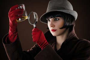 woman detective examines the evidence