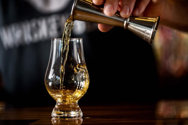 bourbon being poured into a glass