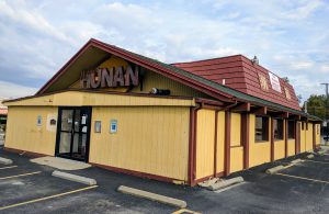 yellow and brown building that says hunan