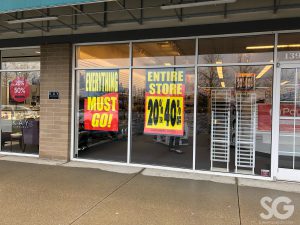 payless: window store front with sale signs