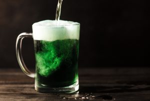 st. patrick's day: green beer in a clear mug