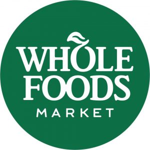 logo of a green circle with Whole Foods Market in white