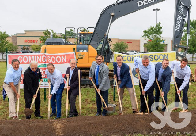 Skyline Chili: group of people holding shovels over a mound of dirt smiling at the camera