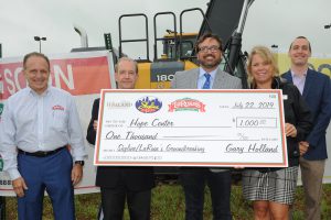 Skyline Chili: group of people presenting a large check