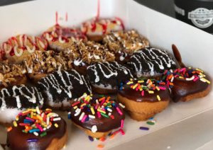 Donut: white plate filled with donuts