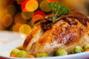 Thanksgiving" turkey with sprouts around it on a white plate