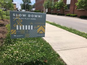 political yard signs turned slow down signs