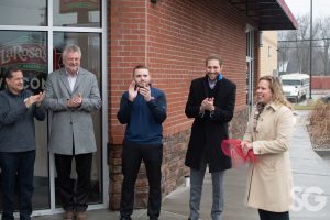 LaRosa's: group of people at a grand opening